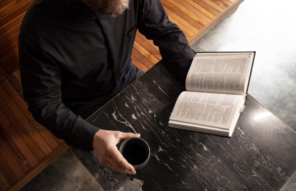 Close up priest reading form bible